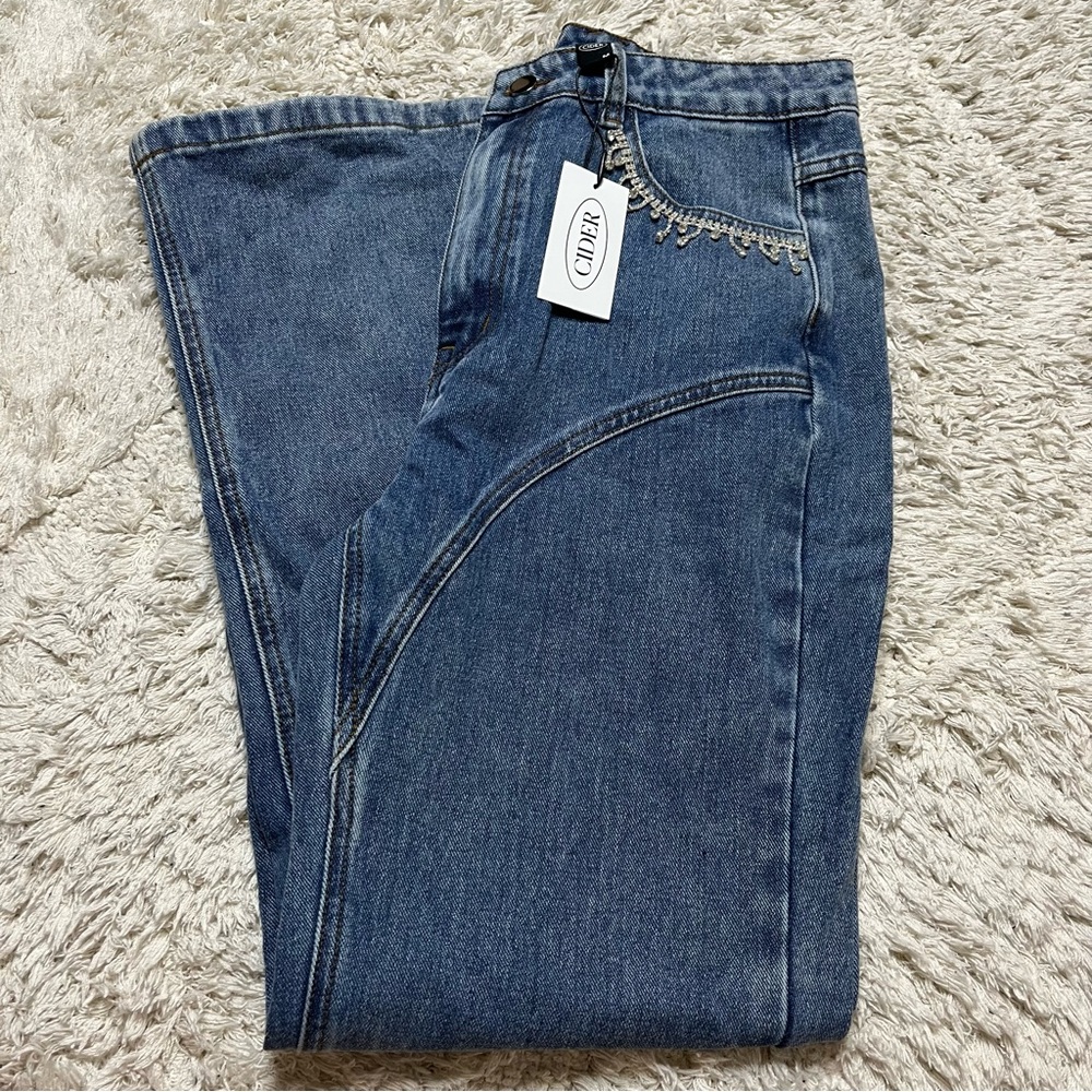 Rhinestone tassel jeans from Cider